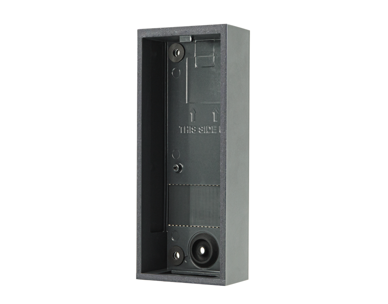 DoorBird surface-mount housing backbox, dark gray metal with front opening and screw holes