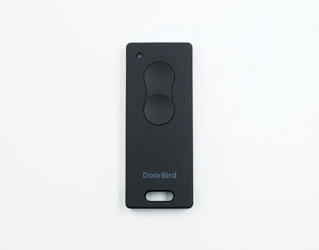 Dark gray key fob remote with two buttons and DoorBird logo