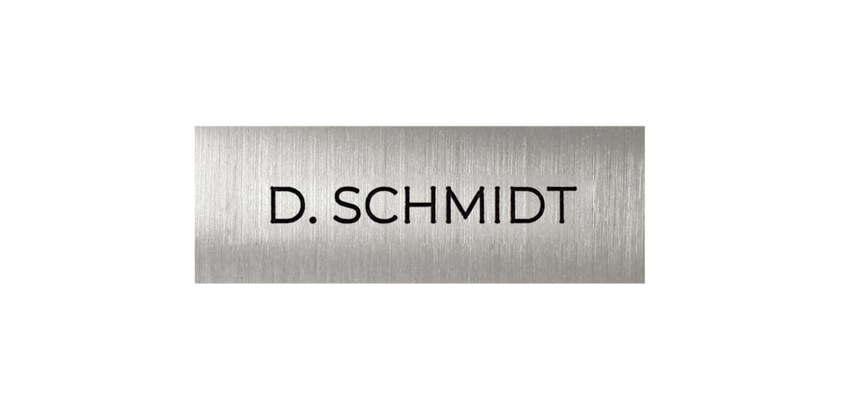 Stainless steel nameplate with engraved text 'D. SCHMIDT'