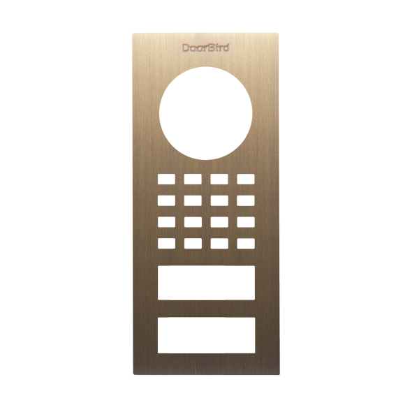 DoorBird front panel in real burnished brass with camera cutout, keypad dots, and call buttons
