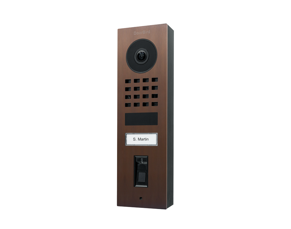 Architectural bronze video door station with camera lens, keypad, and call button