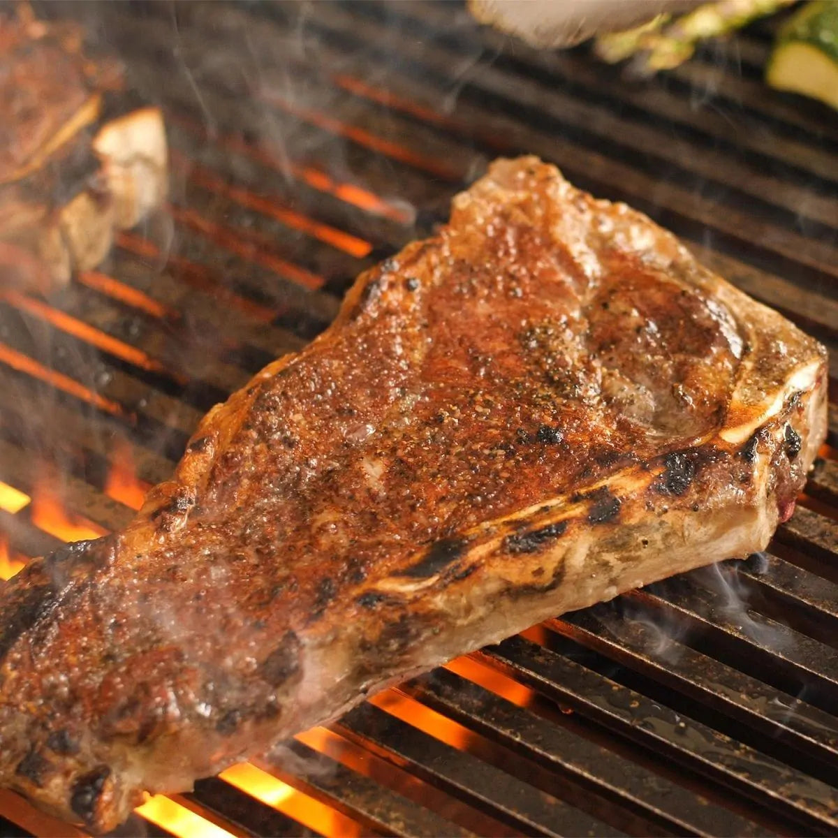 Grilled steak with seared marks on cast-iron grill grates