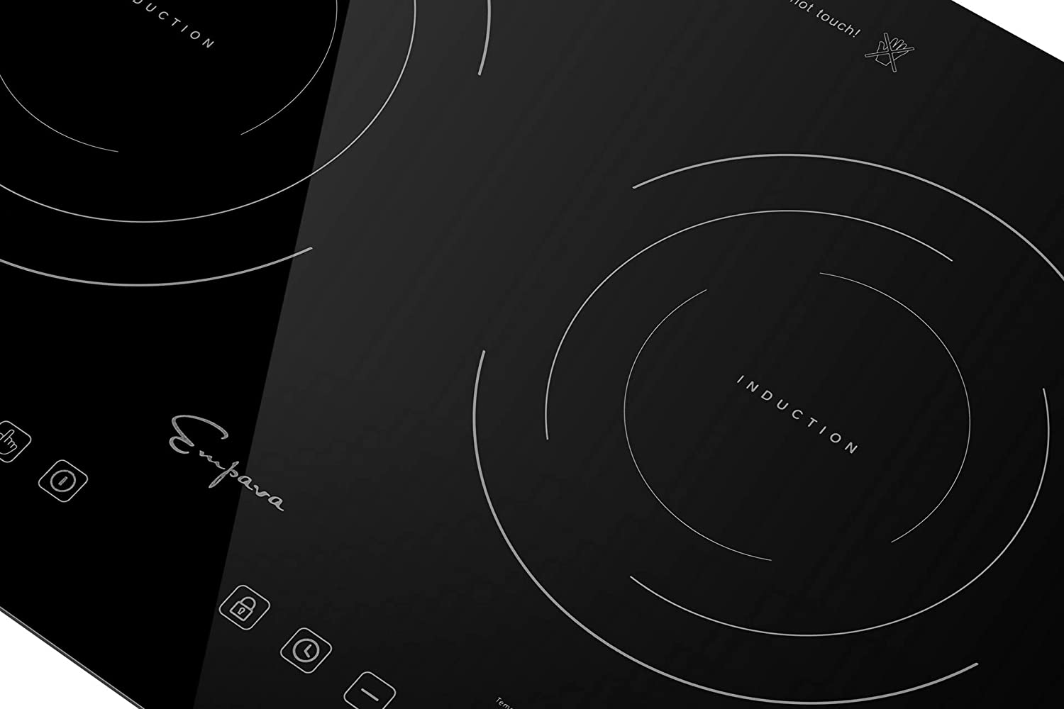 Black induction cooktop surface close-up showing burner ring and touch control symbols