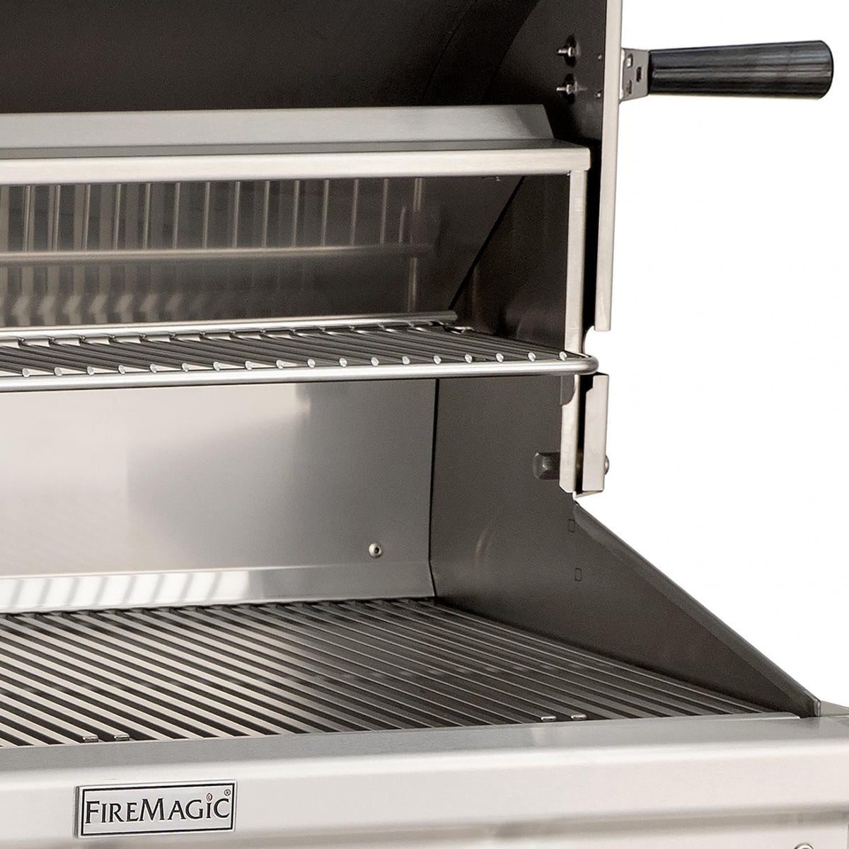 Open stainless grill with side door, cooking grates, and FIREMAGIC label