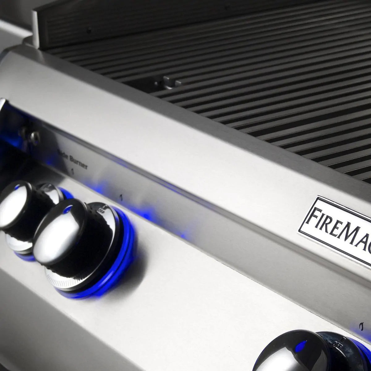 Built-in gas grill control panel with blue-lit knobs and logo label