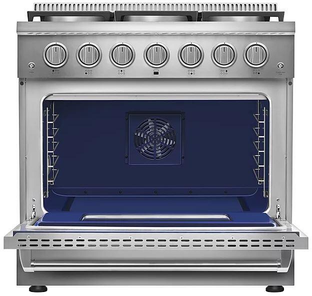 Open stainless gas oven cavity with blue back panel and interior racks