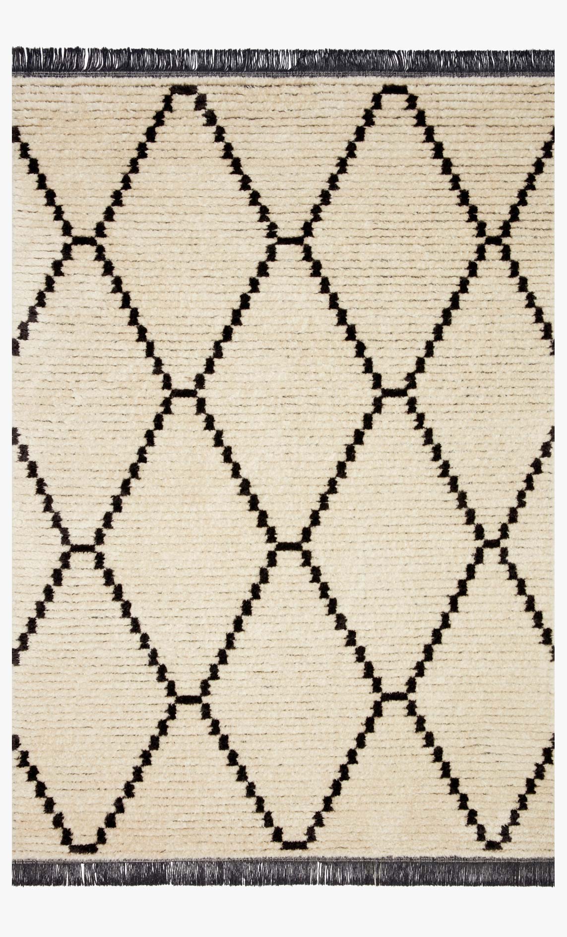 Cream and charcoal power-loomed rug with repeating diamond lattice pattern and dark fringe border.