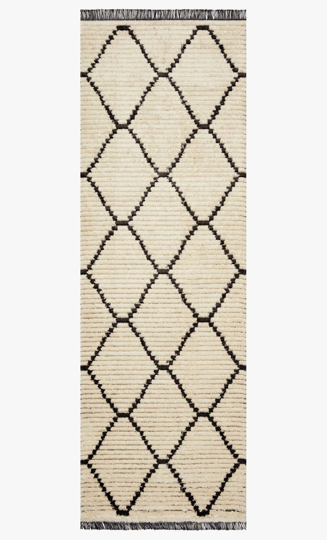 Full view of cream rug with charcoal overlapping diamond pattern and straight dark top fringe.