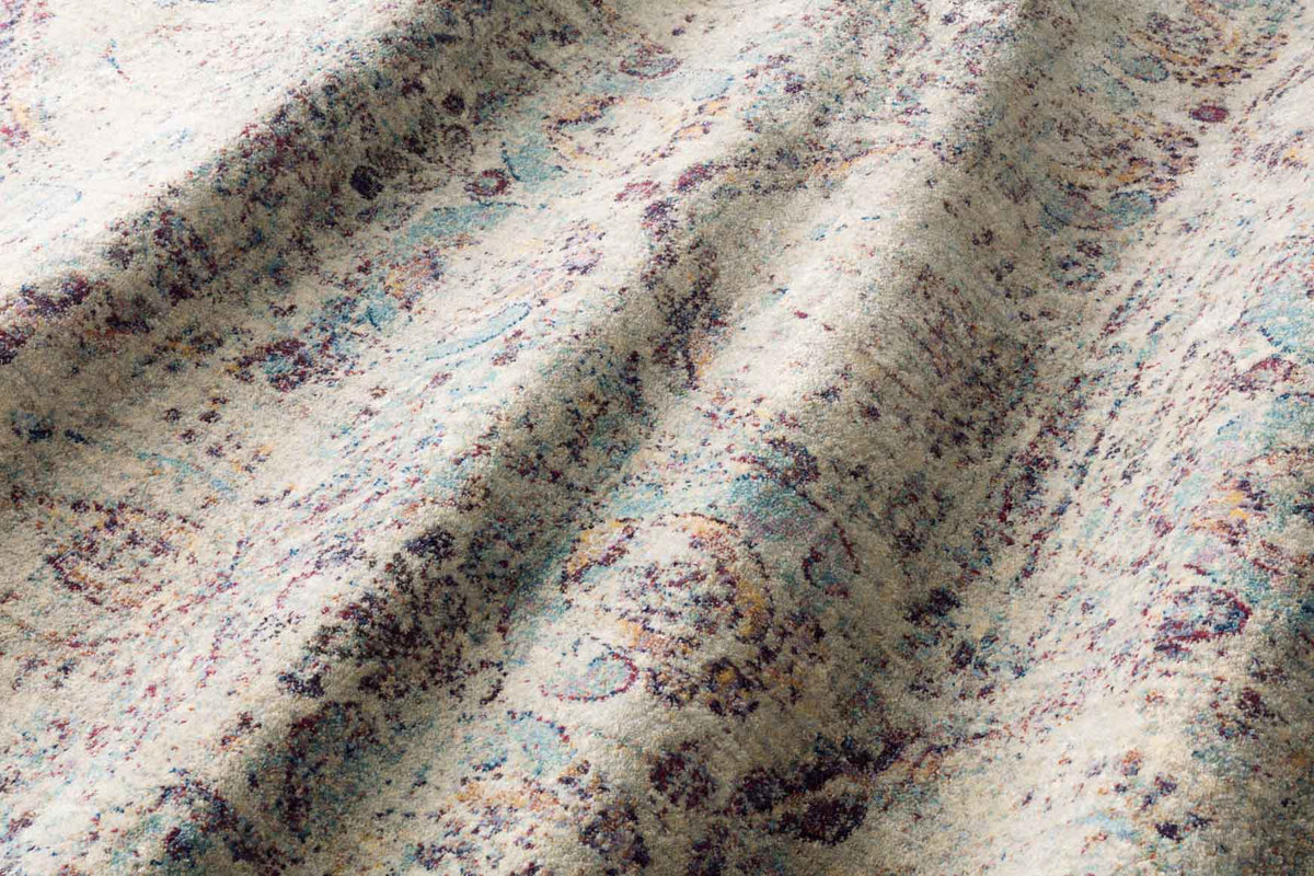 Silver and plum abstract rug texture with darker swirled detail, close-up