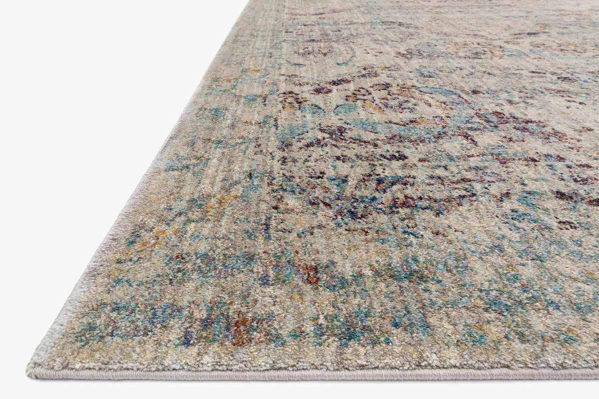 Silver and plum abstract rug corner with low pile and flat woven border