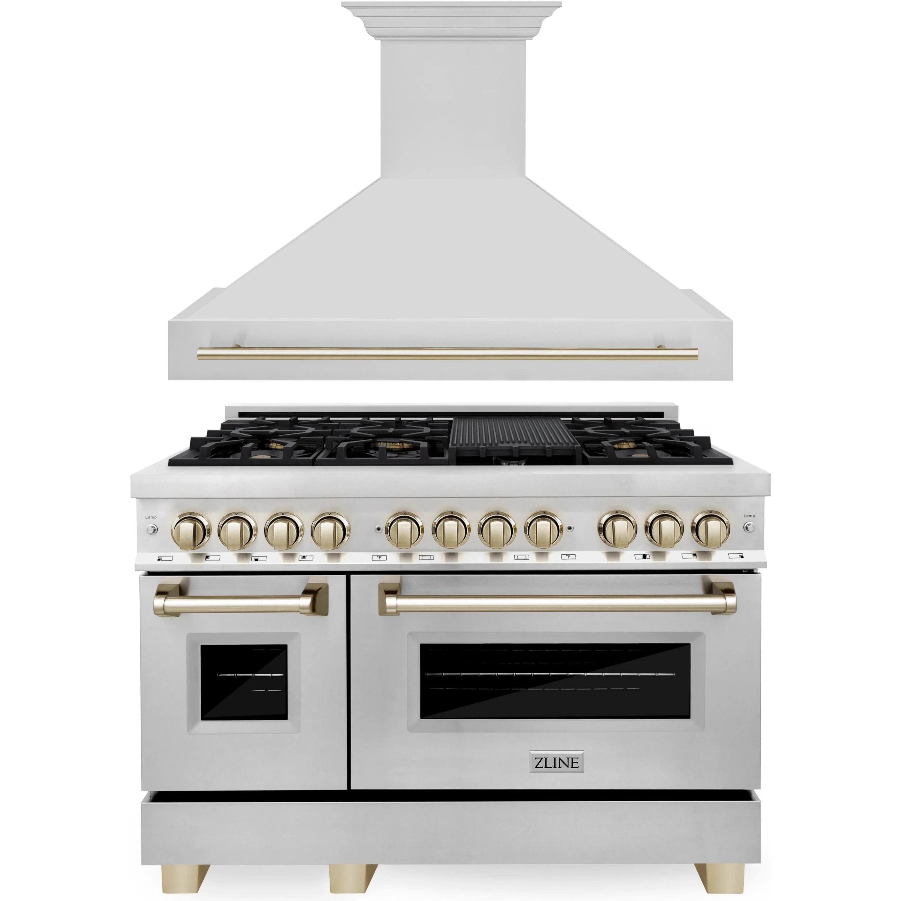 Stainless steel dual fuel range with gold-trimmed knobs under wall hood