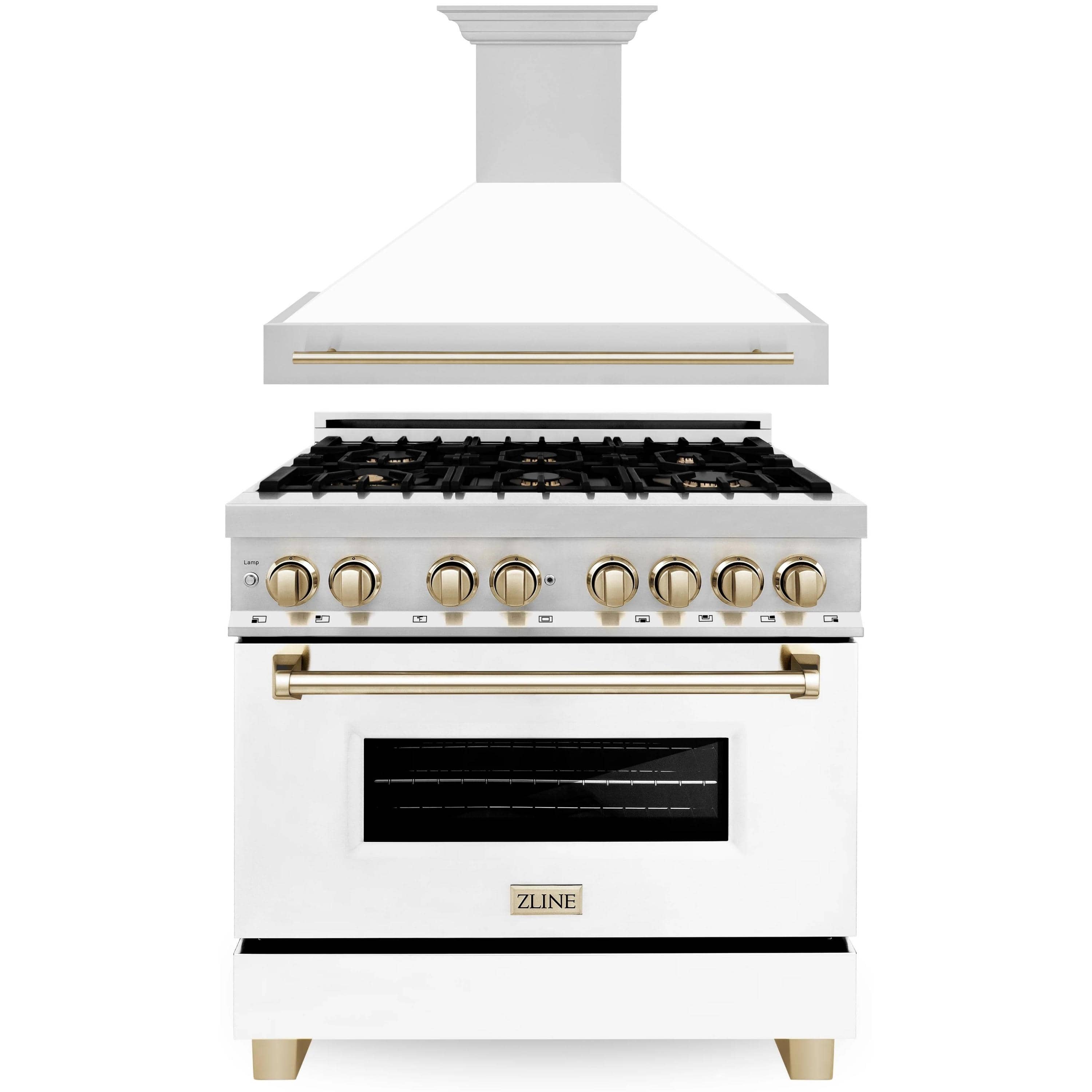 Dual fuel range with wall hood, white cabinet, black grates, gold control knobs