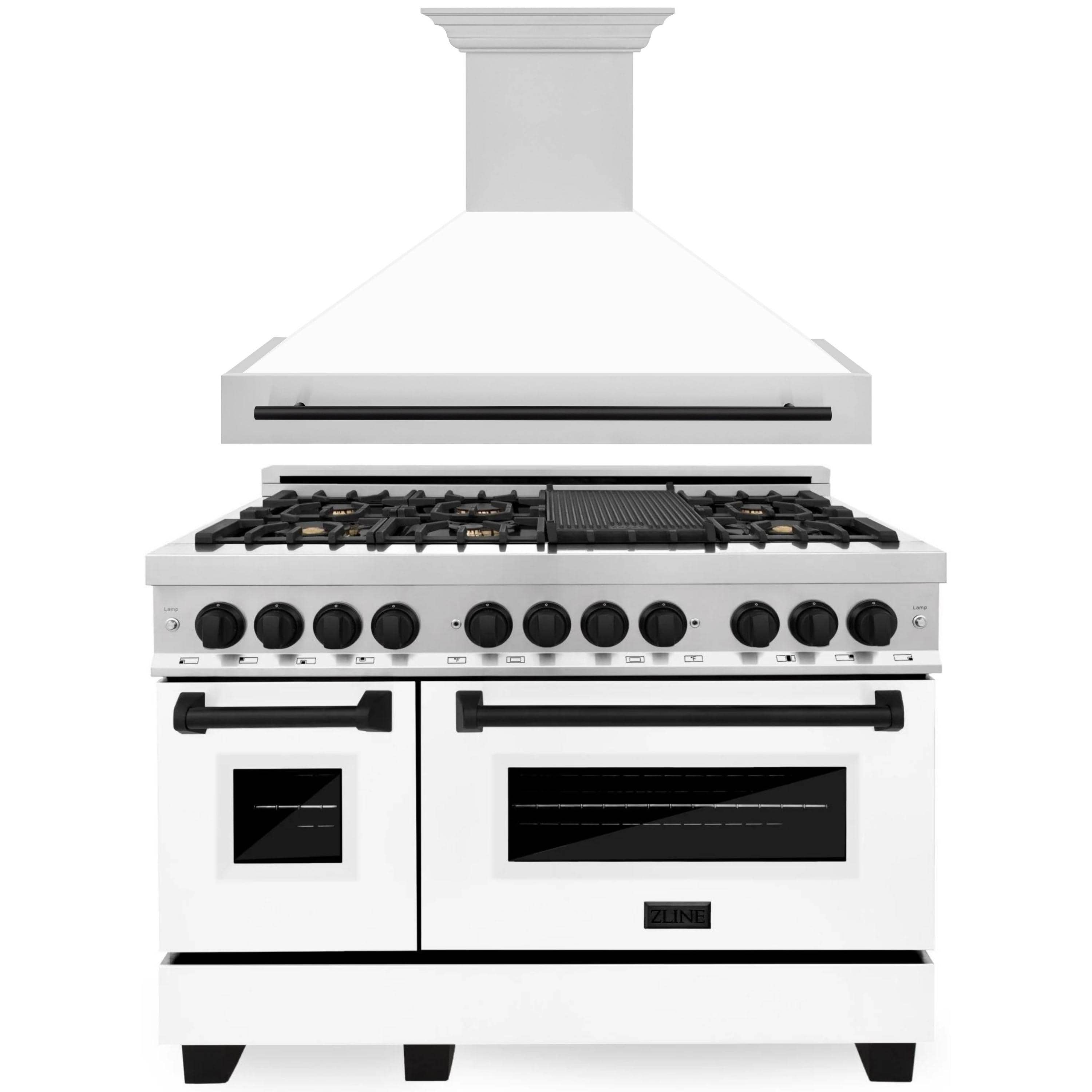 Stainless steel and white dual fuel range with black knobs and matching range hood