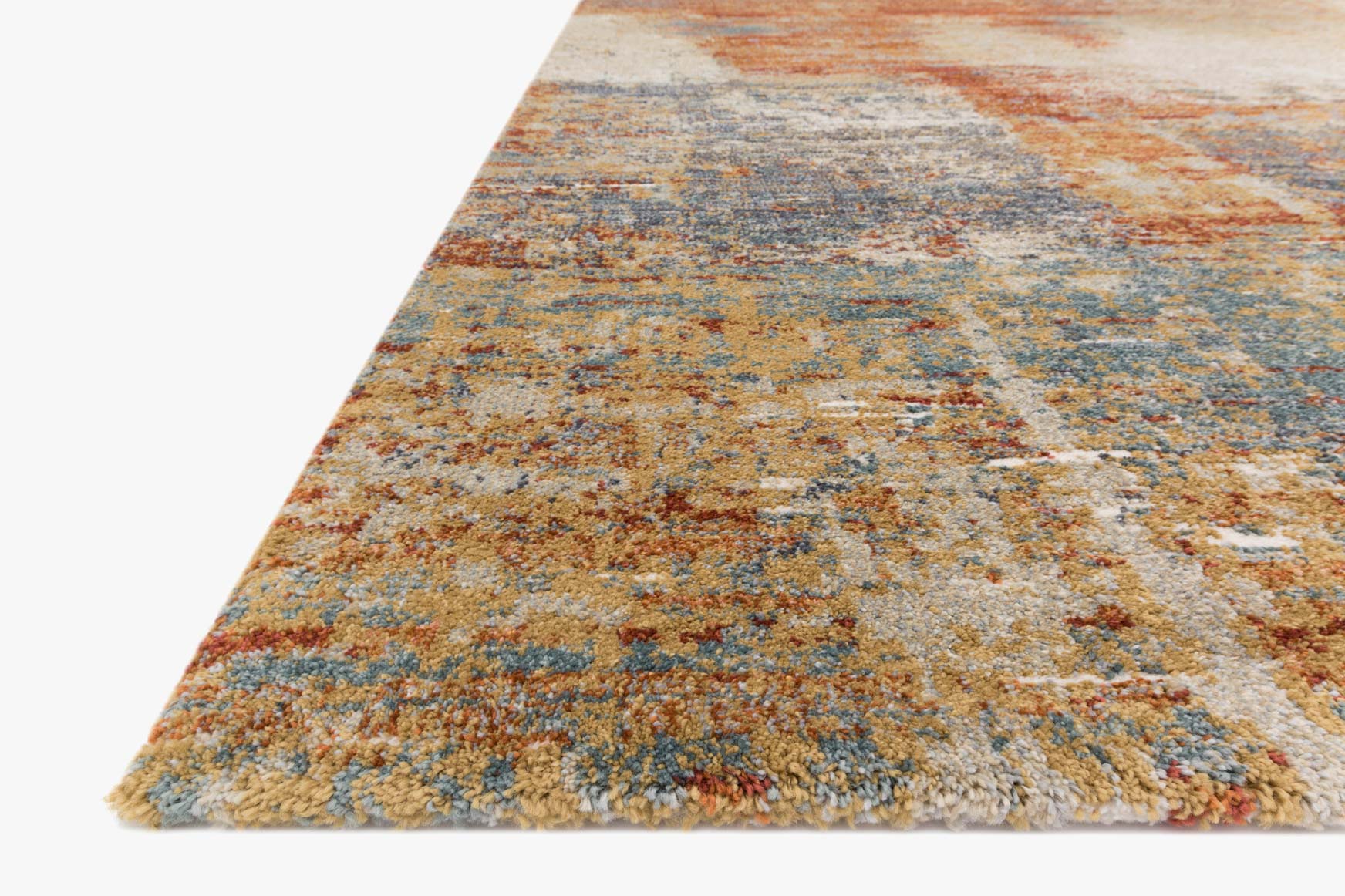 Corner view of terracotta abstract power-loomed rug with speckled beige and blue