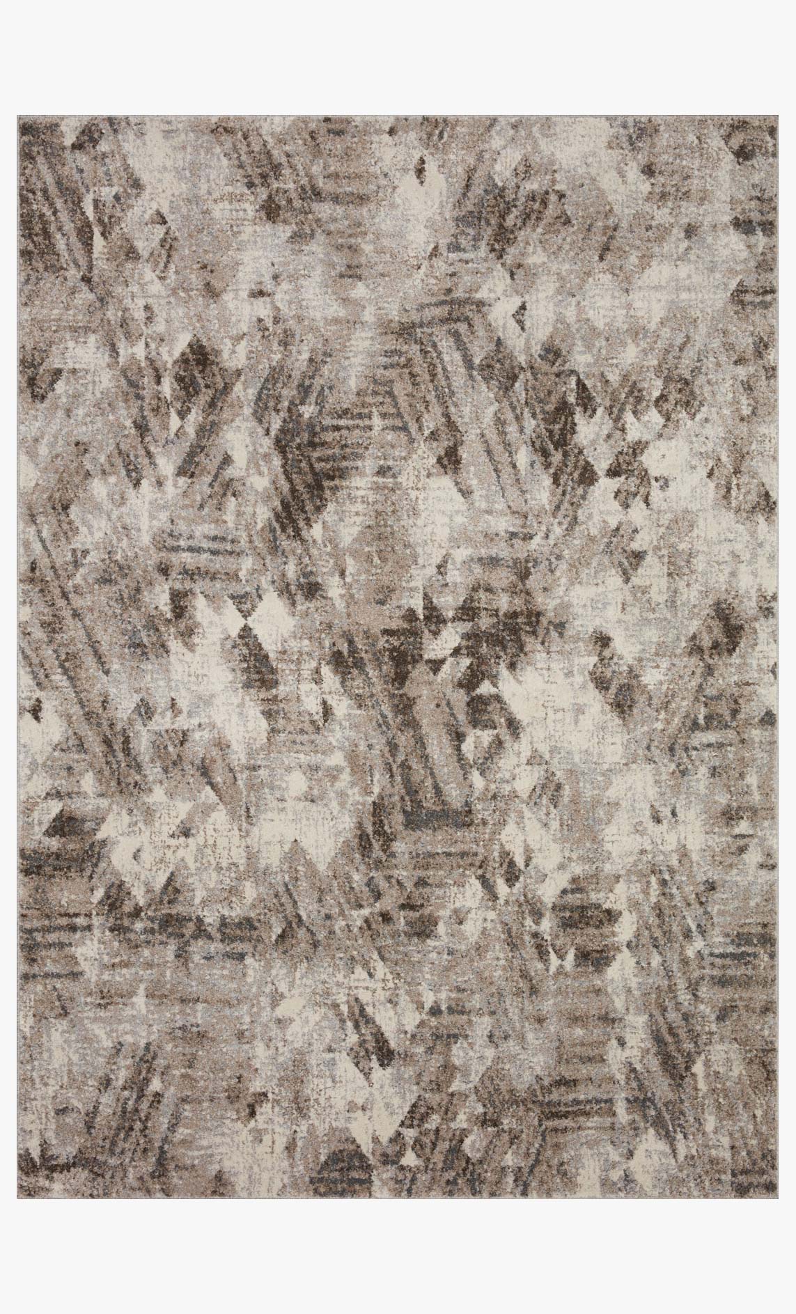 Power loomed rug in natural and mocha with abstract distressed pattern