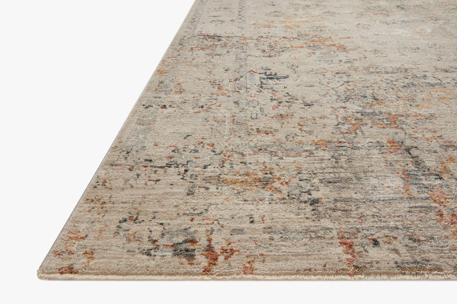 Power loom rug corner with short pile texture and distressed motif in beige and muted colors
