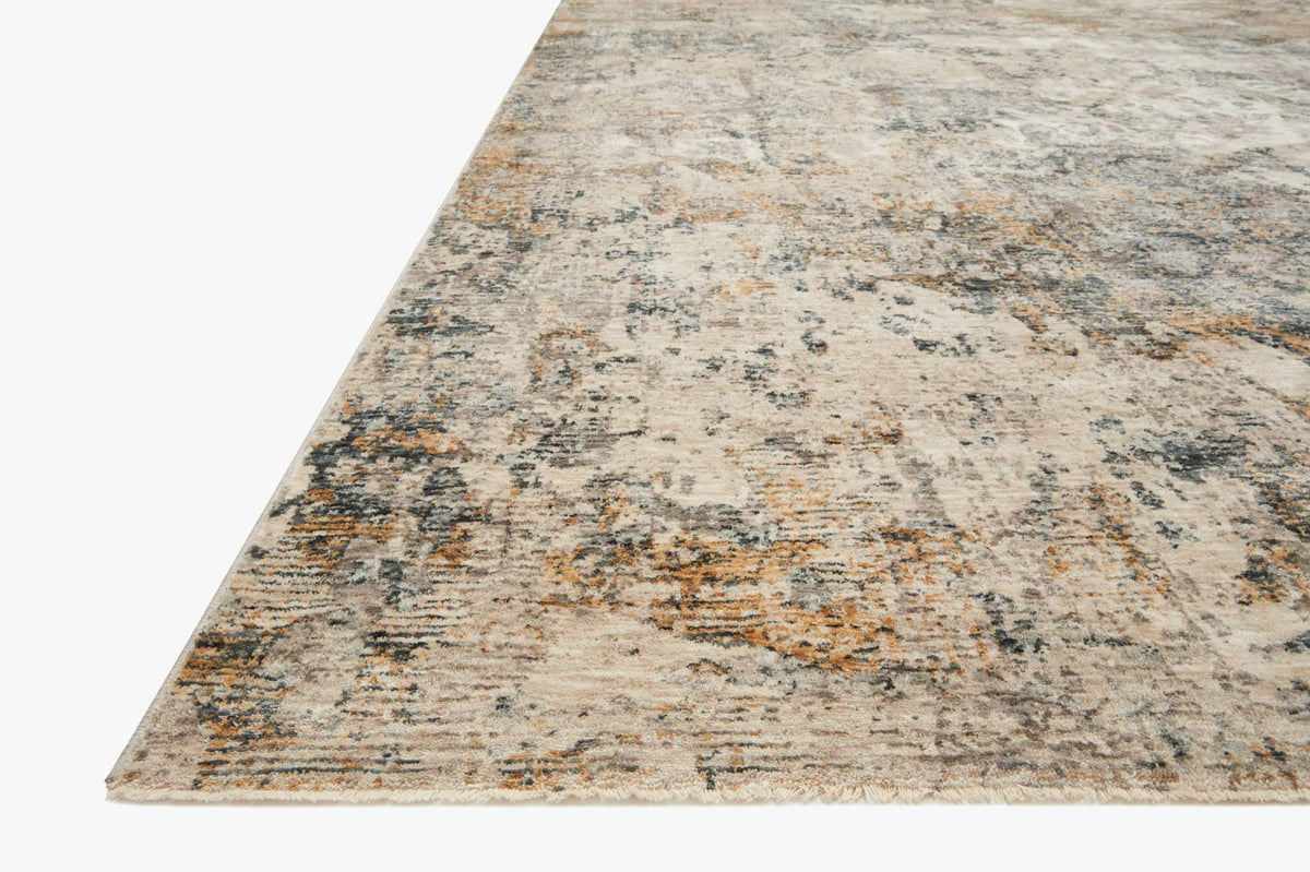 Ocean blue and beige distressed abstract rug shown at an angle with textured surface