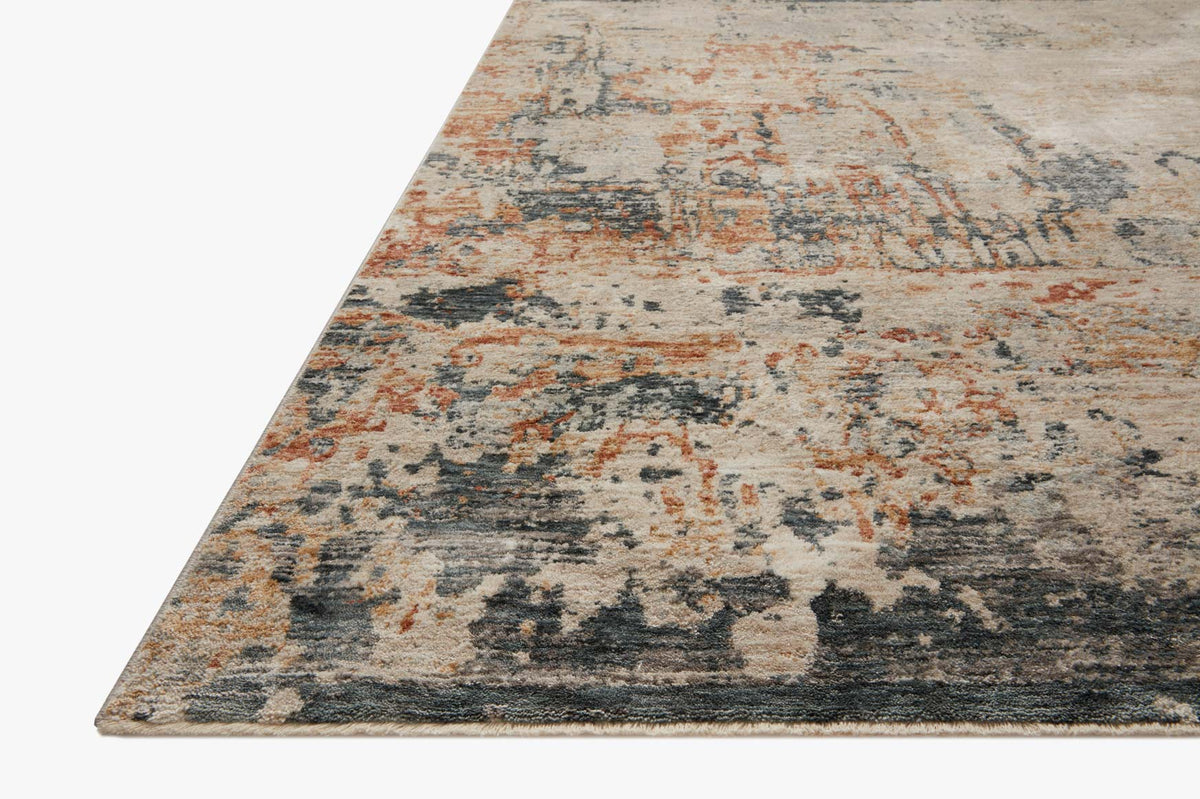 Corner view of contemporary power-loomed rug with distressed abstract stone and rust tones.
