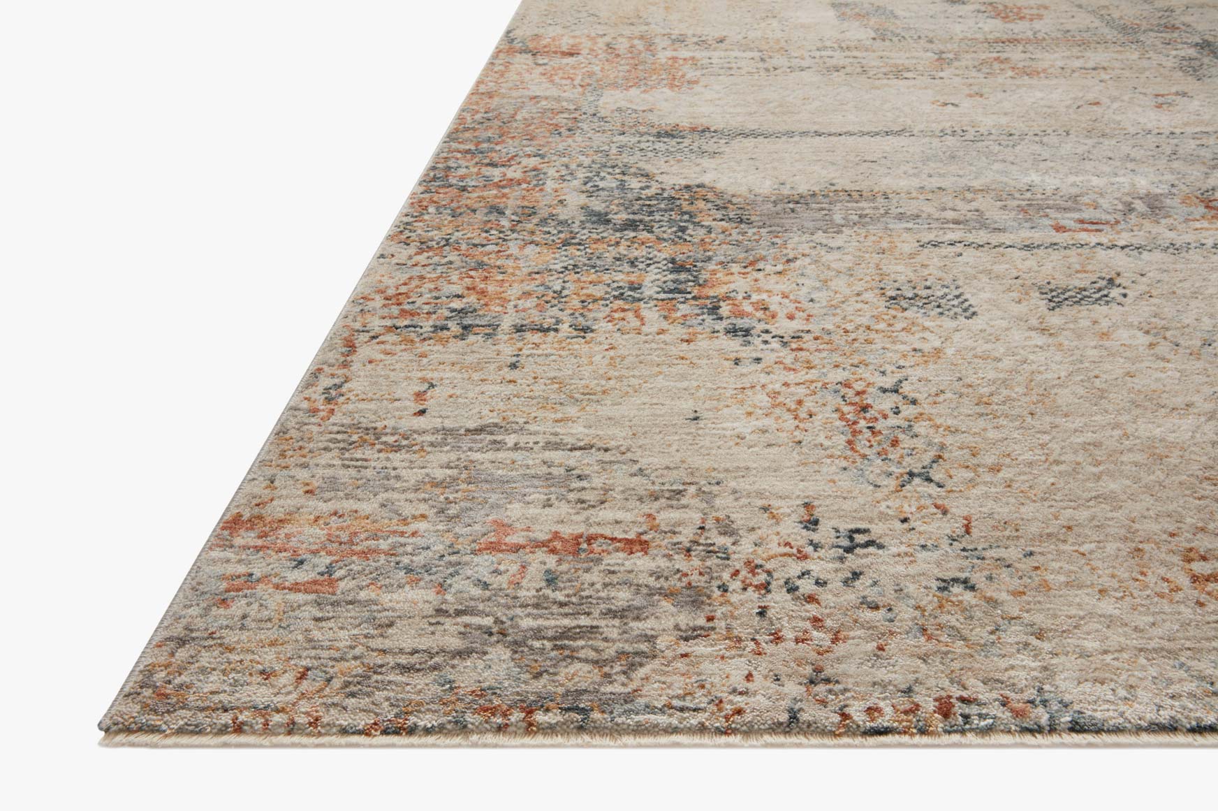 Corner view of rectangular rug with textured distressed abstract pattern in sand, blue-gray, rust