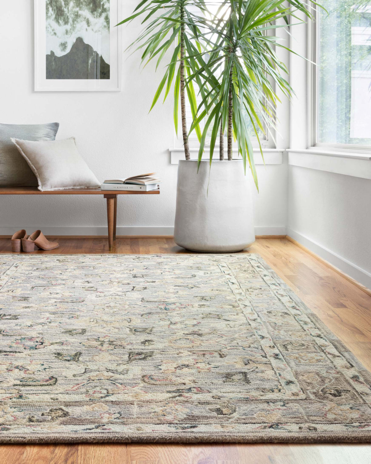 Light blue traditional hooked rug with multicolor motifs, rectangular, flat lay