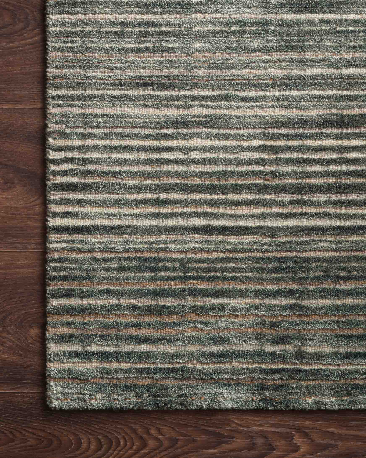Traditional hand-loomed rug corner, dark lagoon with thin horizontal stripes