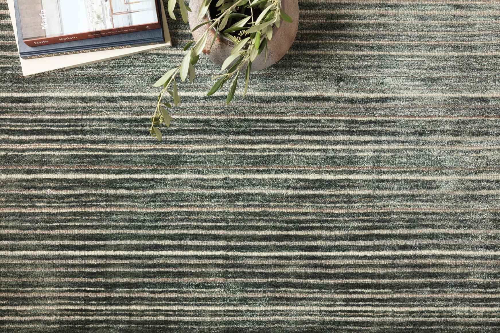 Traditional hand-loomed rug close-up, dark lagoon with thin horizontal stripes