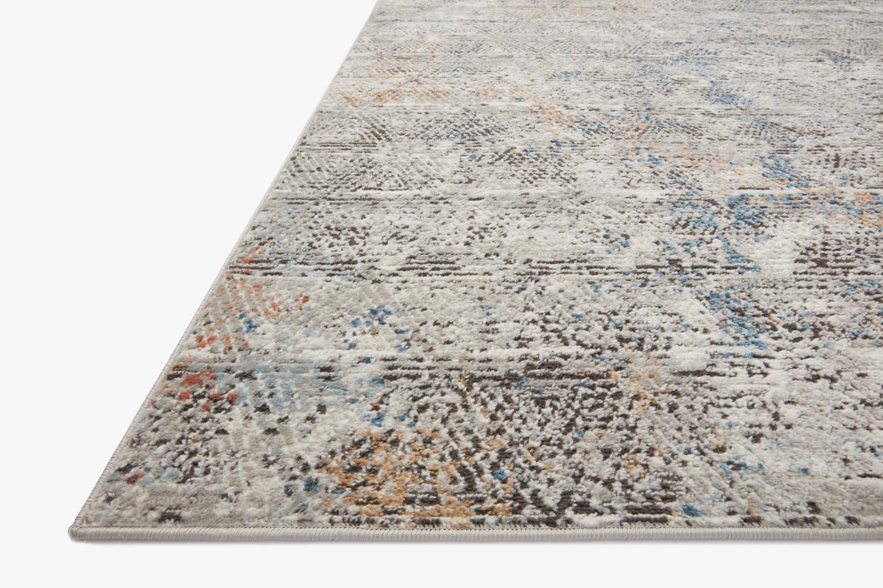 Close-up grey abstract rug corner with distressed texture and blue accent lines