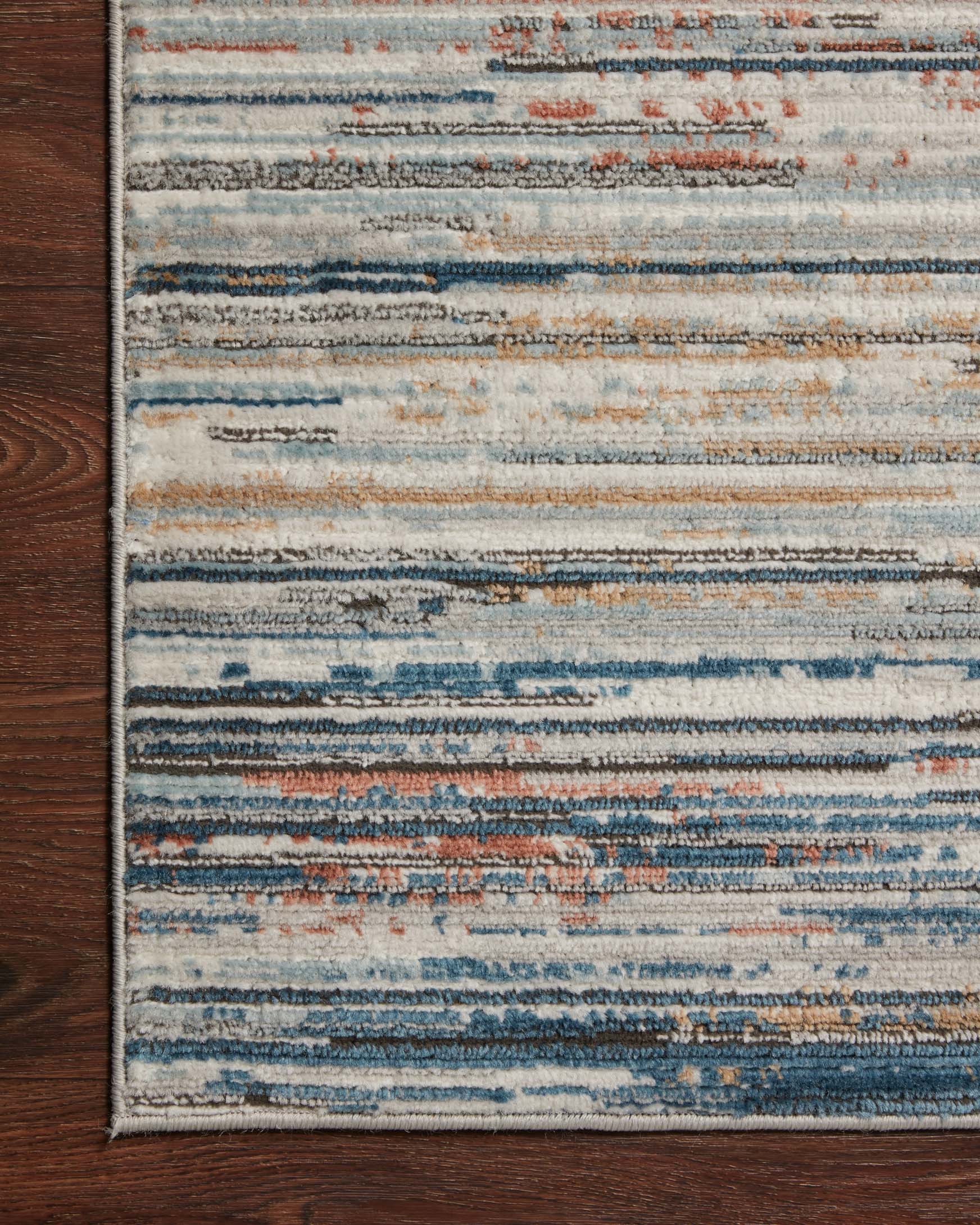 Contemporary power-loomed rug with light pebble base and blue, rust horizontal stripes
