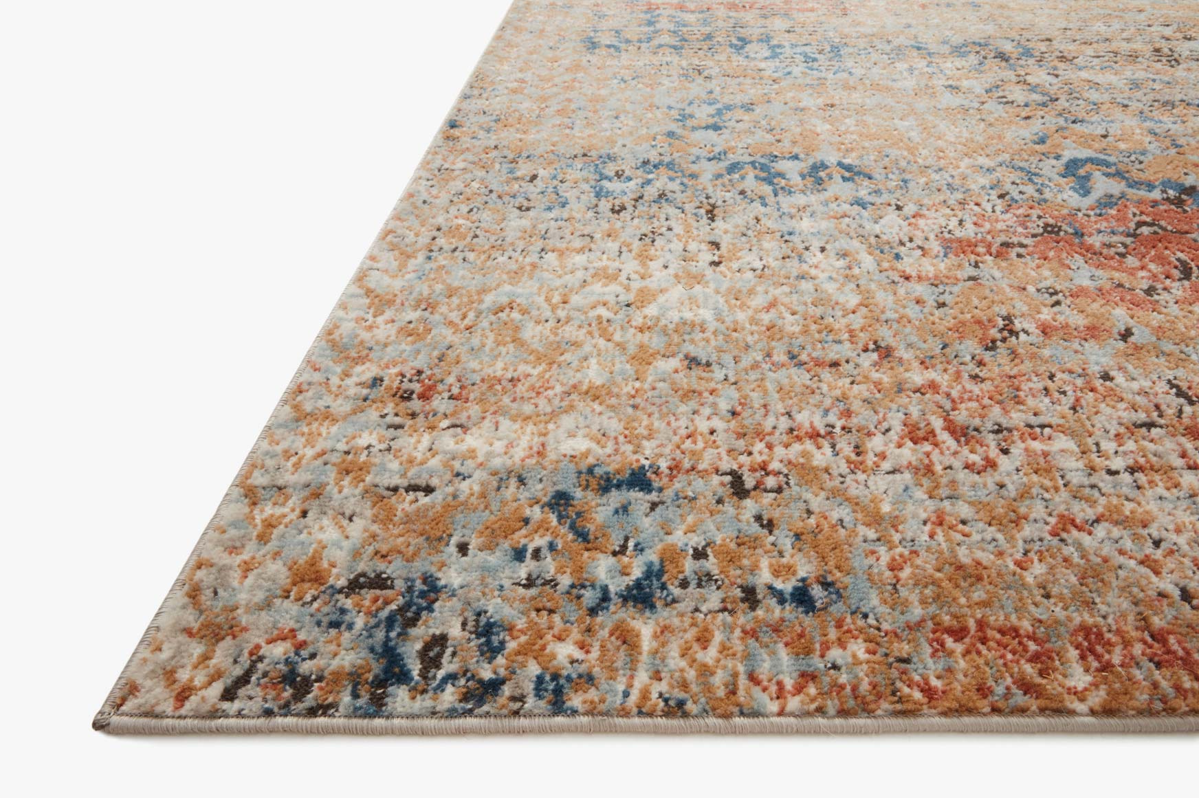 Corner of multicolor rug with distressed border and speckled blue, orange, beige fibers