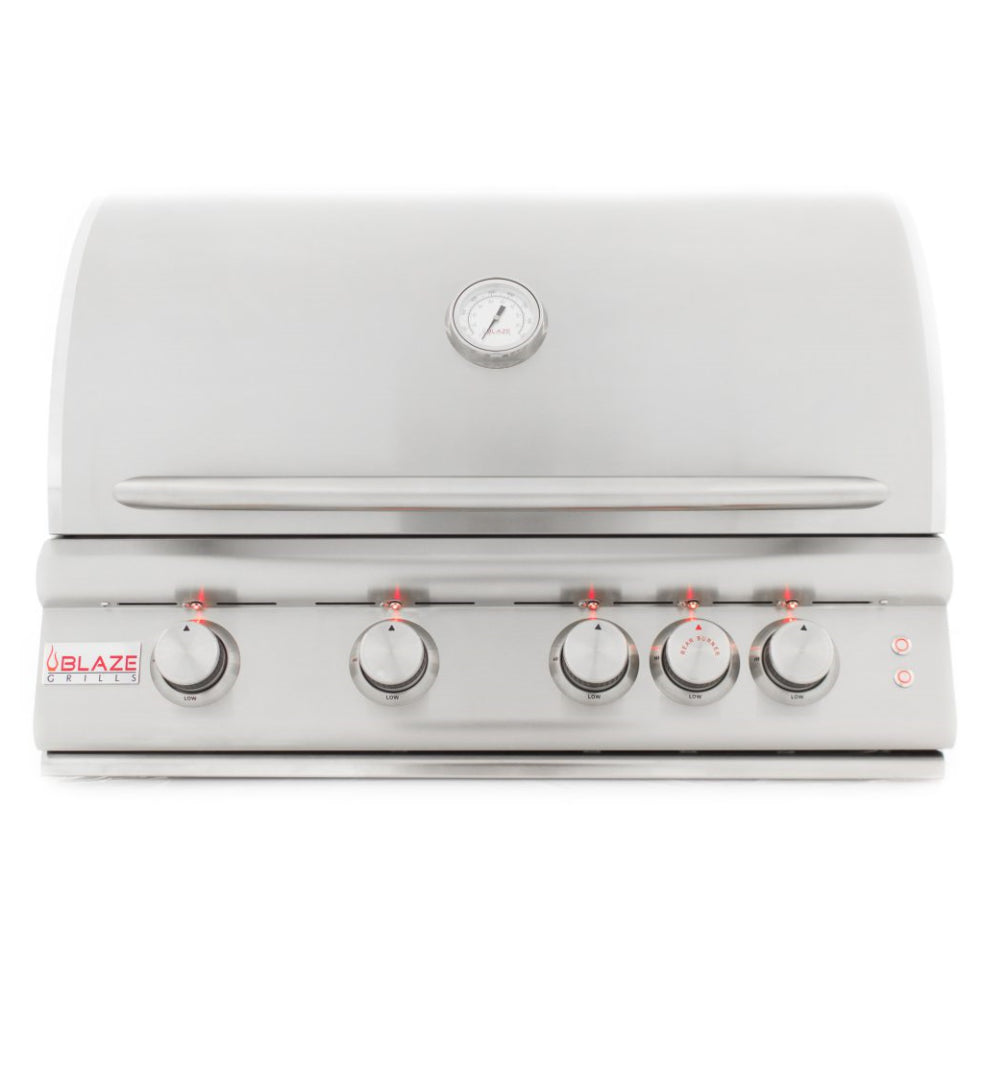 White exterior natural gas grill with control knobs and temperature gauge
