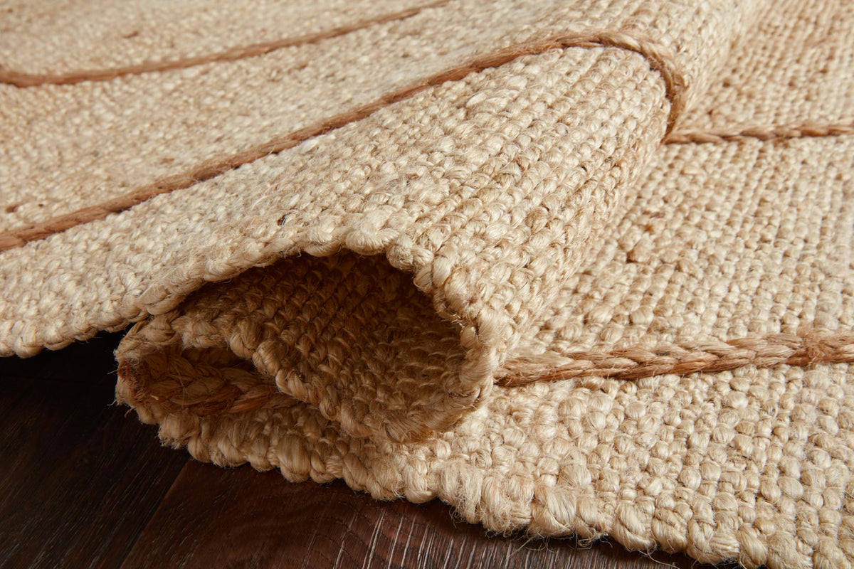 Hand-woven rug edge detail with fringed border and visible looped texture