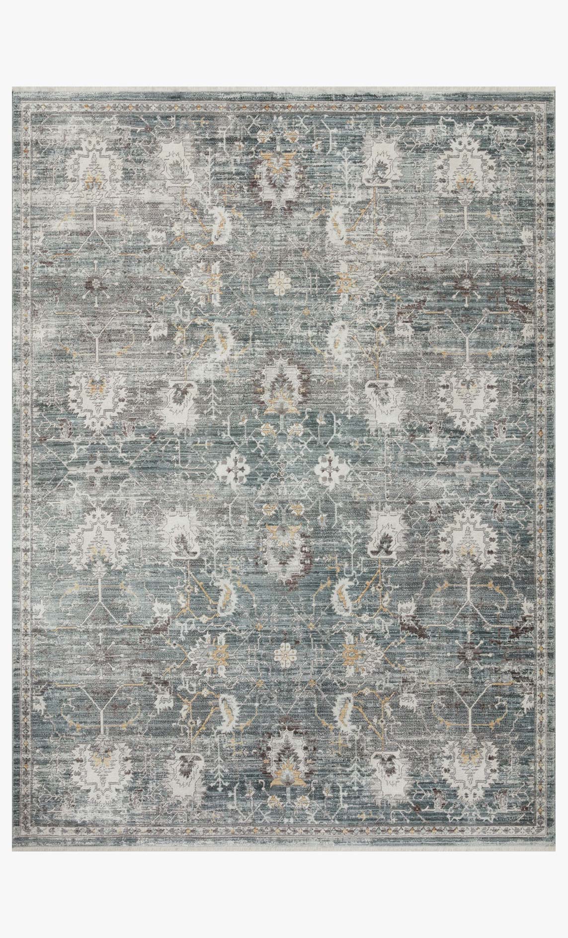 Lagoon and ivory area rug featuring ornate distressed geometric allover pattern