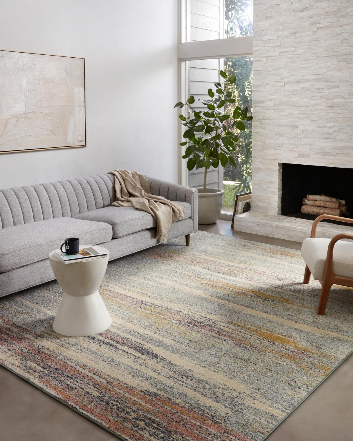 Contemporary power-loomed rug with pebble base and thin multicolor stripe pattern