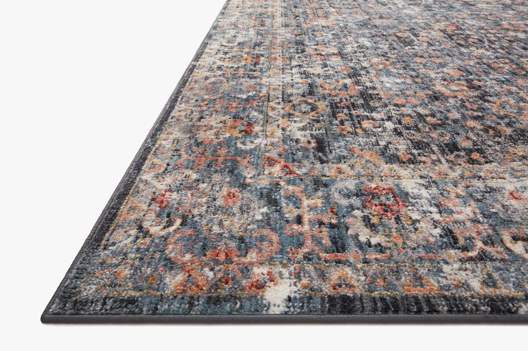 Blue, cream, and rust distressed area rug with ornate medallion design