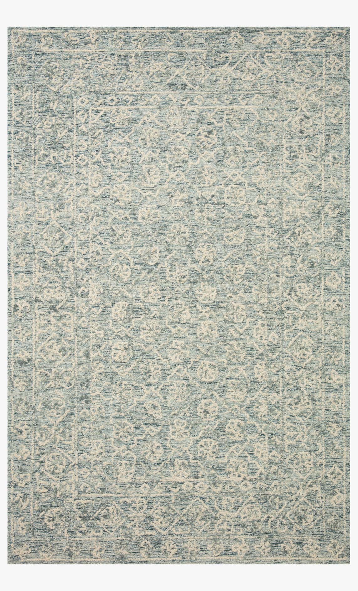 Ocean and ivory hand-tufted rug with ornate distressed medallion pattern