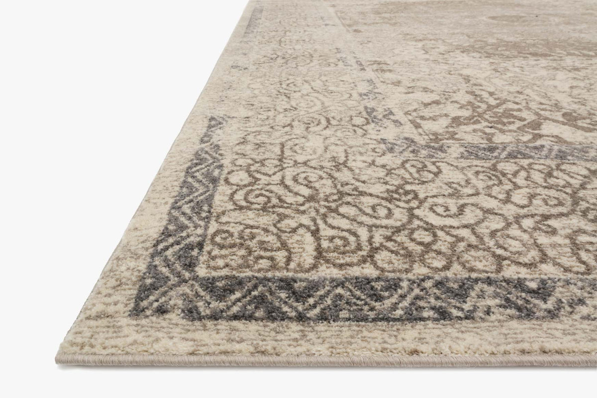 Power-loomed rug corner with geometric border and scroll motifs, taupe and sand