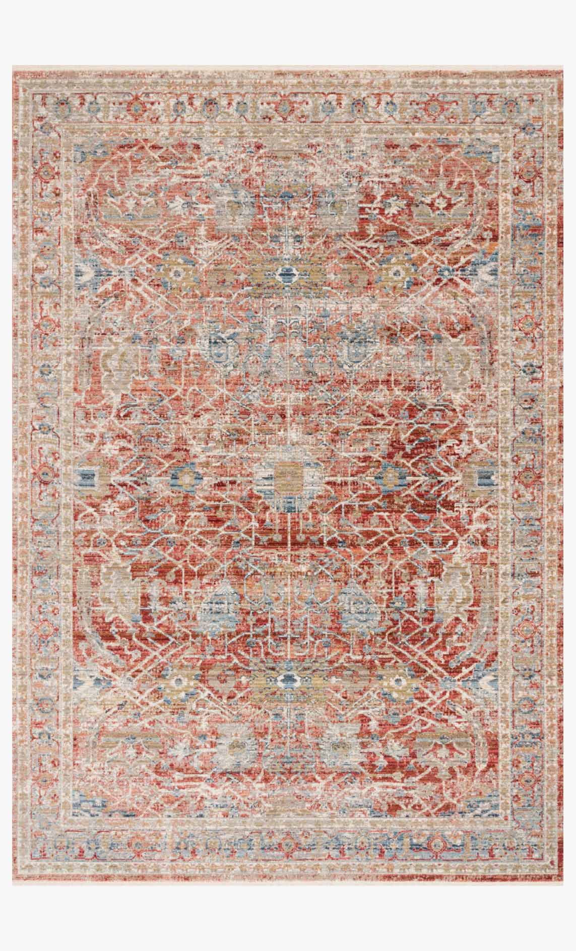 Red and ivory traditional power-loomed rug with distressed geometric medallion pattern.