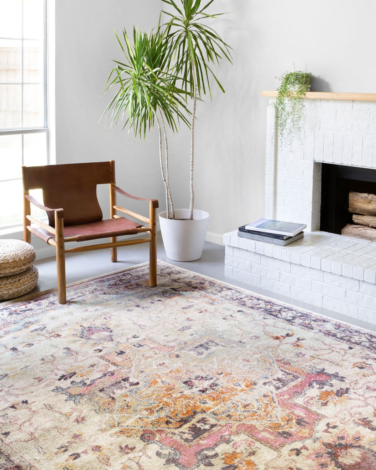 Ivory and charcoal power-loomed rug with vintage floral geometric pattern.