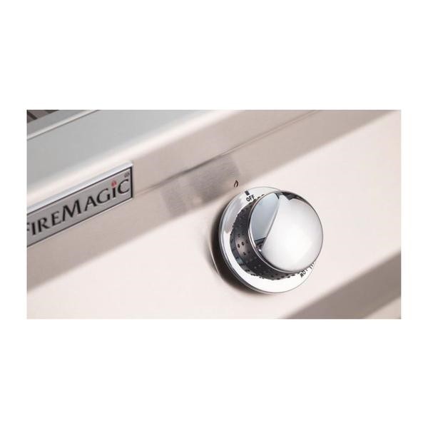 FireMagic control knob on stainless grill panel with OFF/heat markings