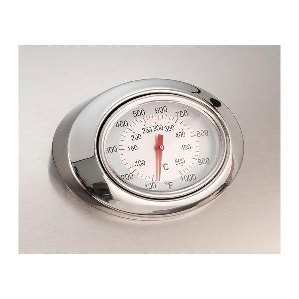 Analog thermometer with chrome bezel and red needle on stainless grill panel