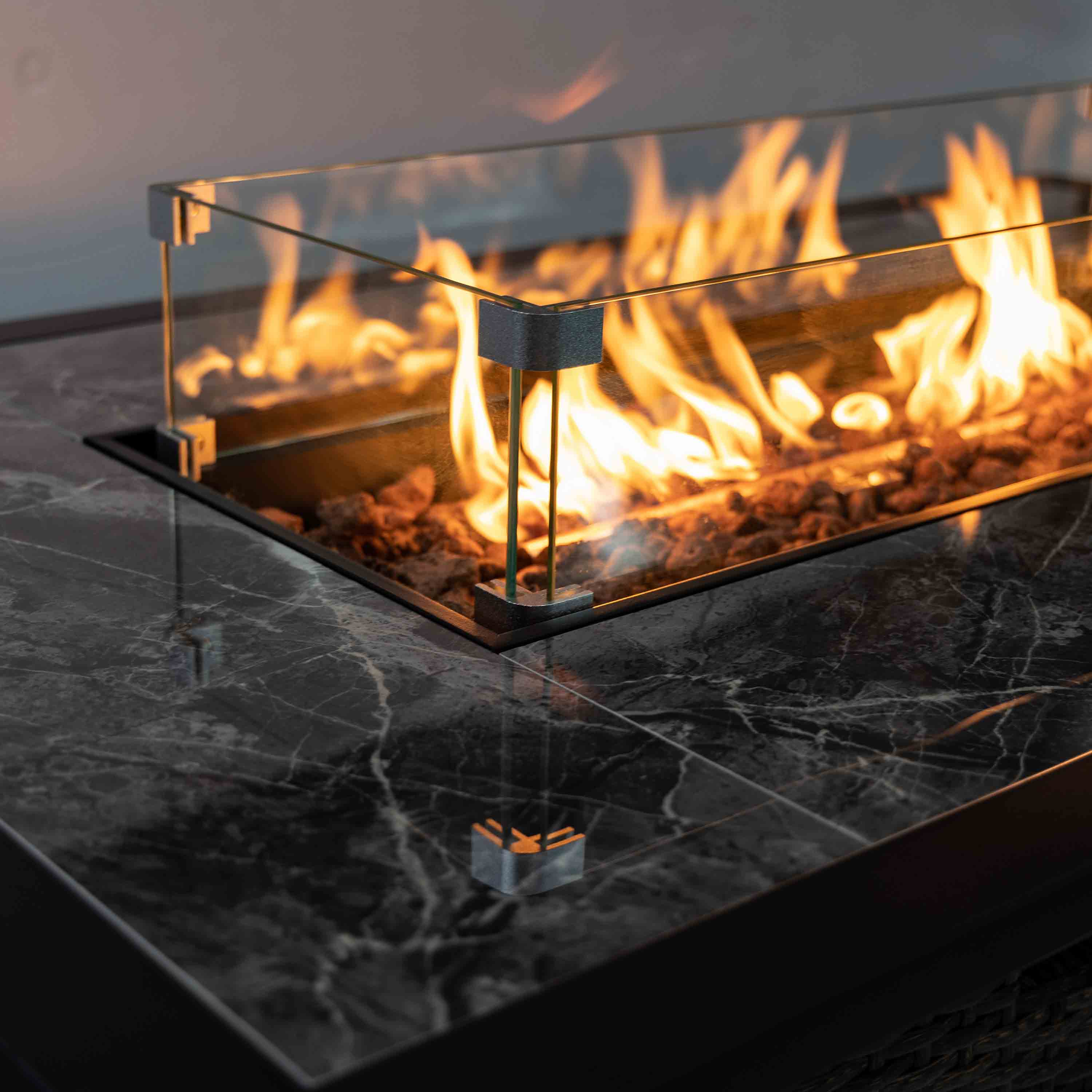 Brown wicker propane gas fire pit with glass sides and flame burner