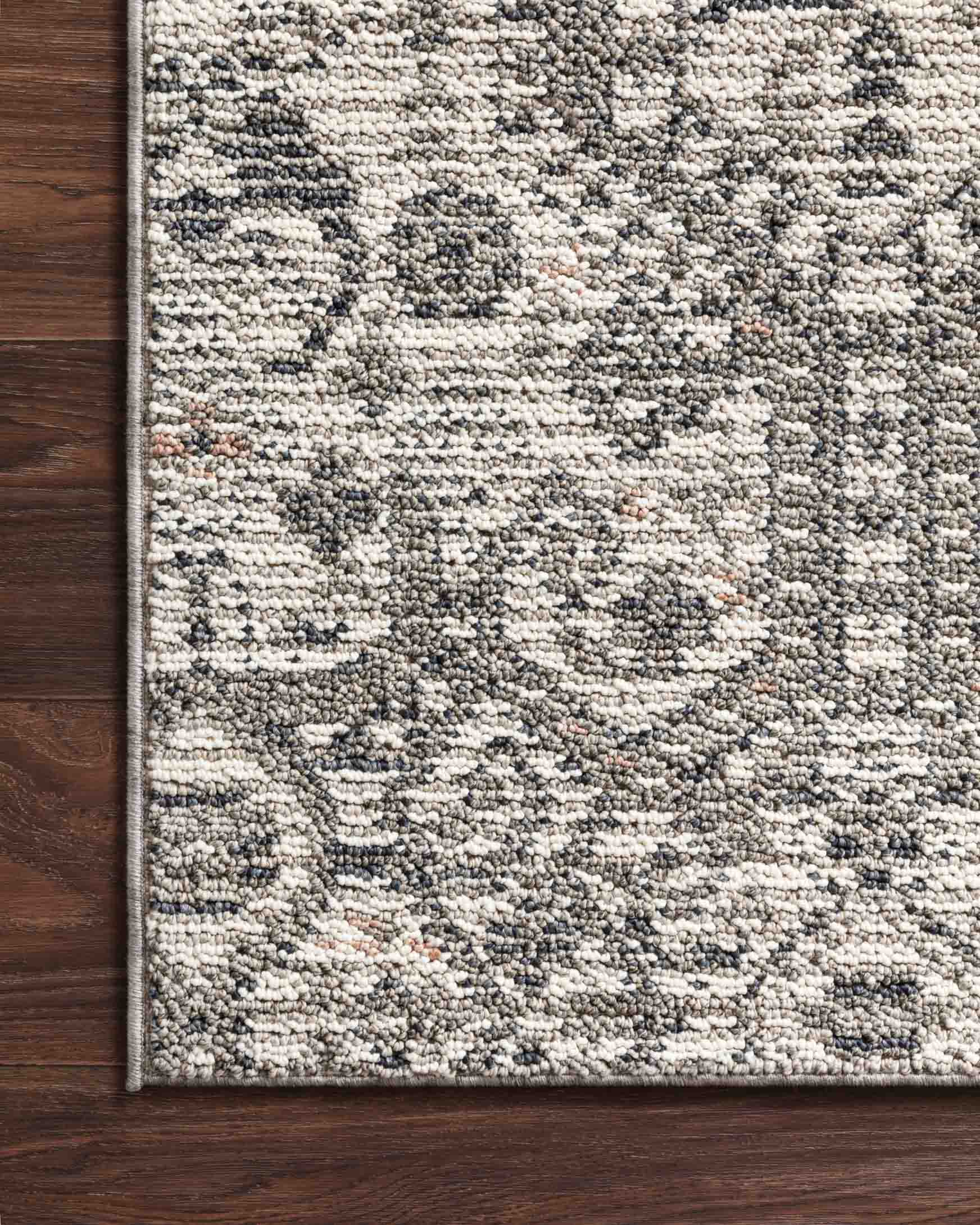 Ivory rug with gray geometric pattern and dense textured woven pile