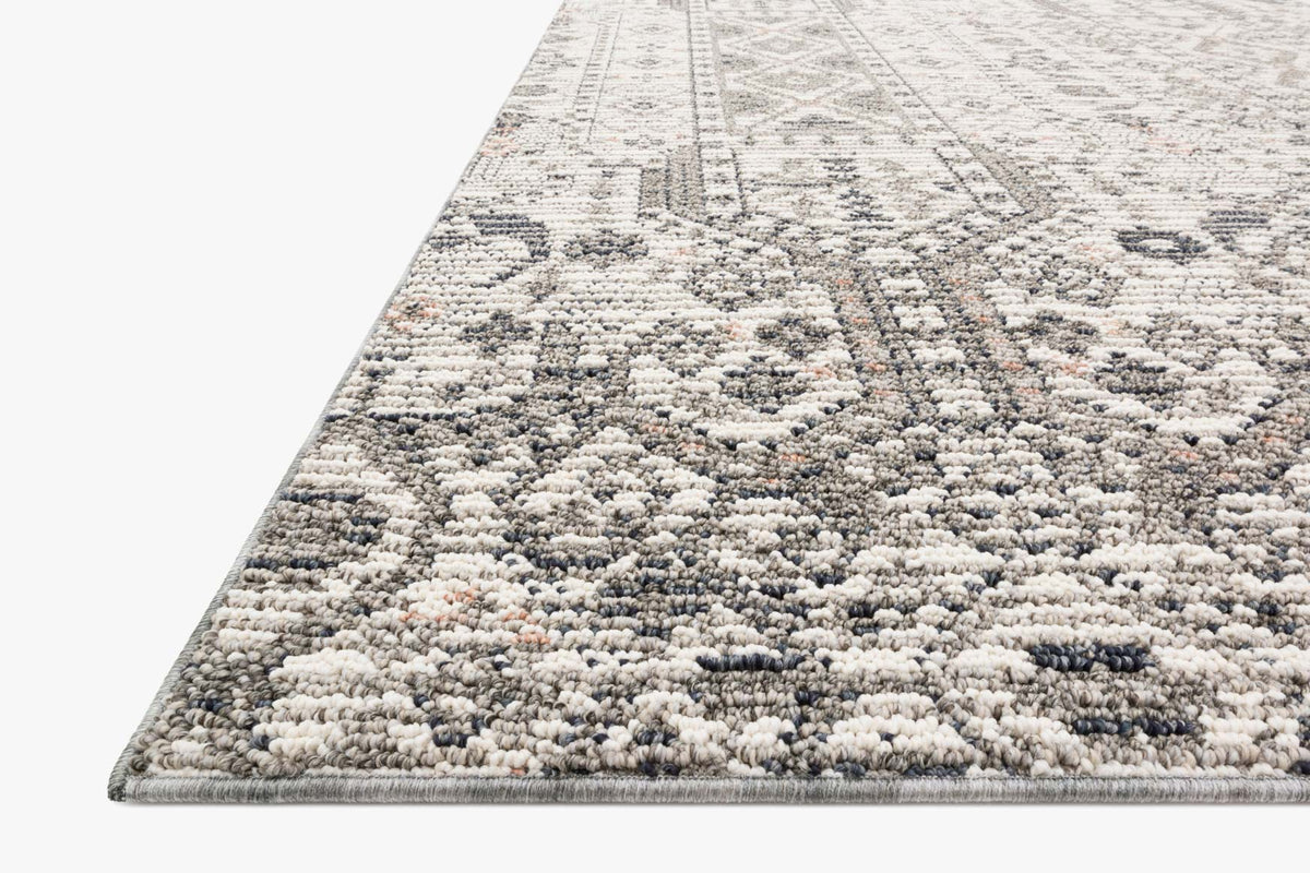 Ivory indoor/outdoor rug with dense textured pile and geometric border in gray