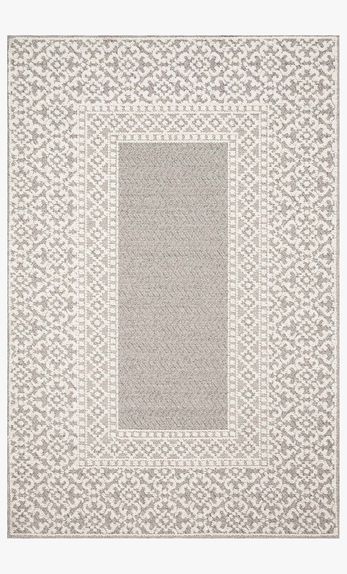 Grey and ivory indoor/outdoor power-loomed rug with ornate border and central panel
