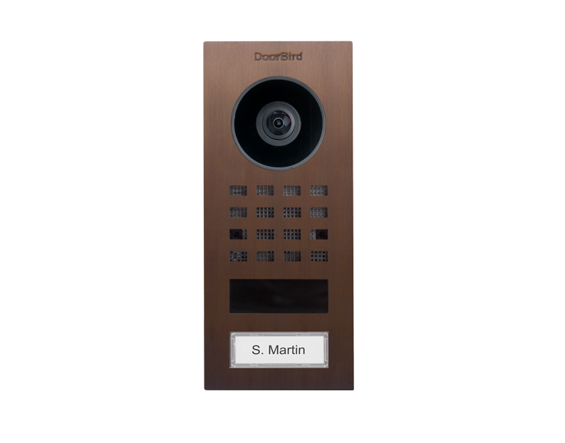 Bronze video intercom panel with camera lens, keypad matrix, and S. Martin label