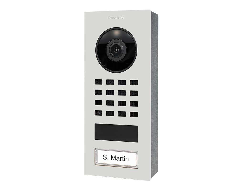 DoorBird surface-mount video intercom with wide camera module, keypad, nameplate, traffic white