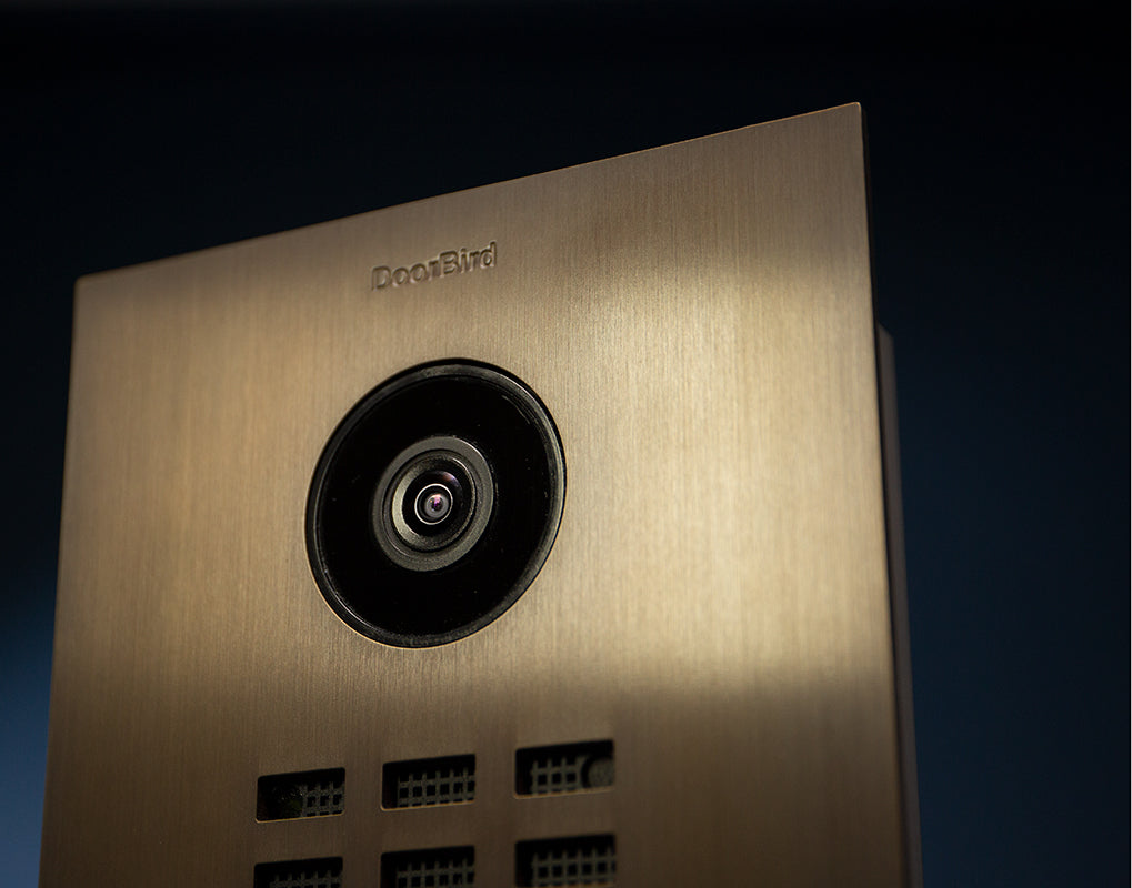 DoorBird bronze IP video door station close-up of camera lens and small keypad buttons
