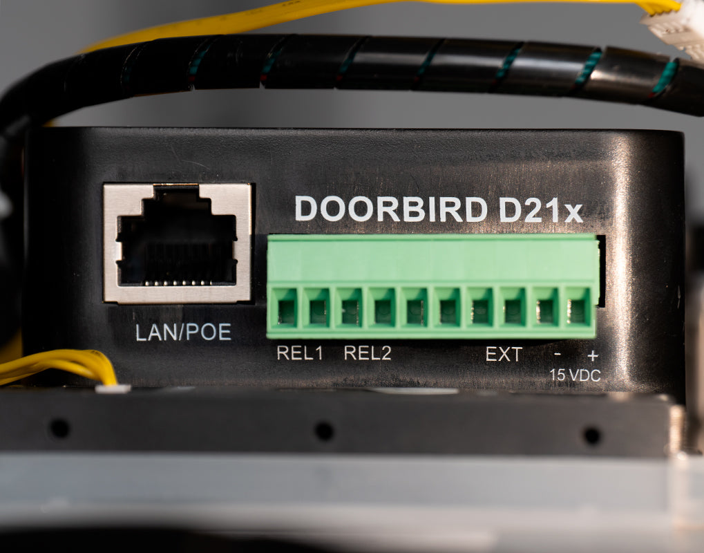 DoorBird D21x door station electronics close-up, LAN/POE and relay terminal blocks