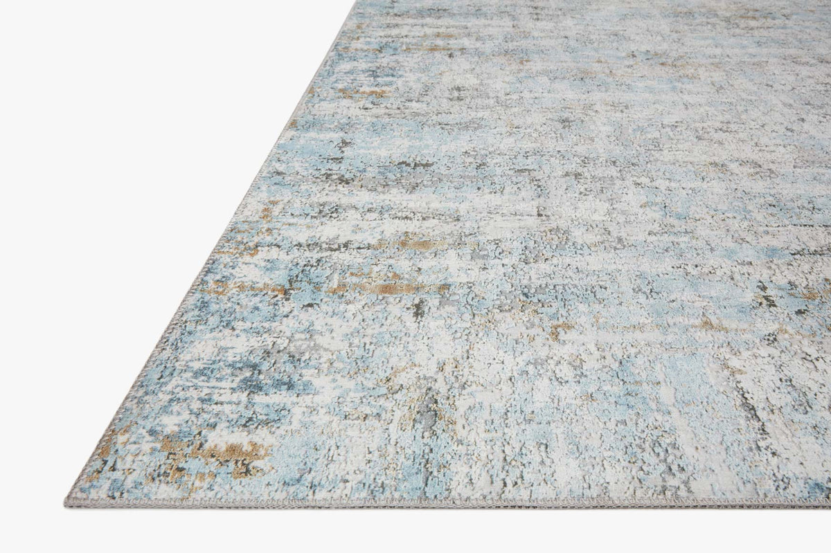 Ivory and sky blue rug with distressed abstract pattern, diagonal corner