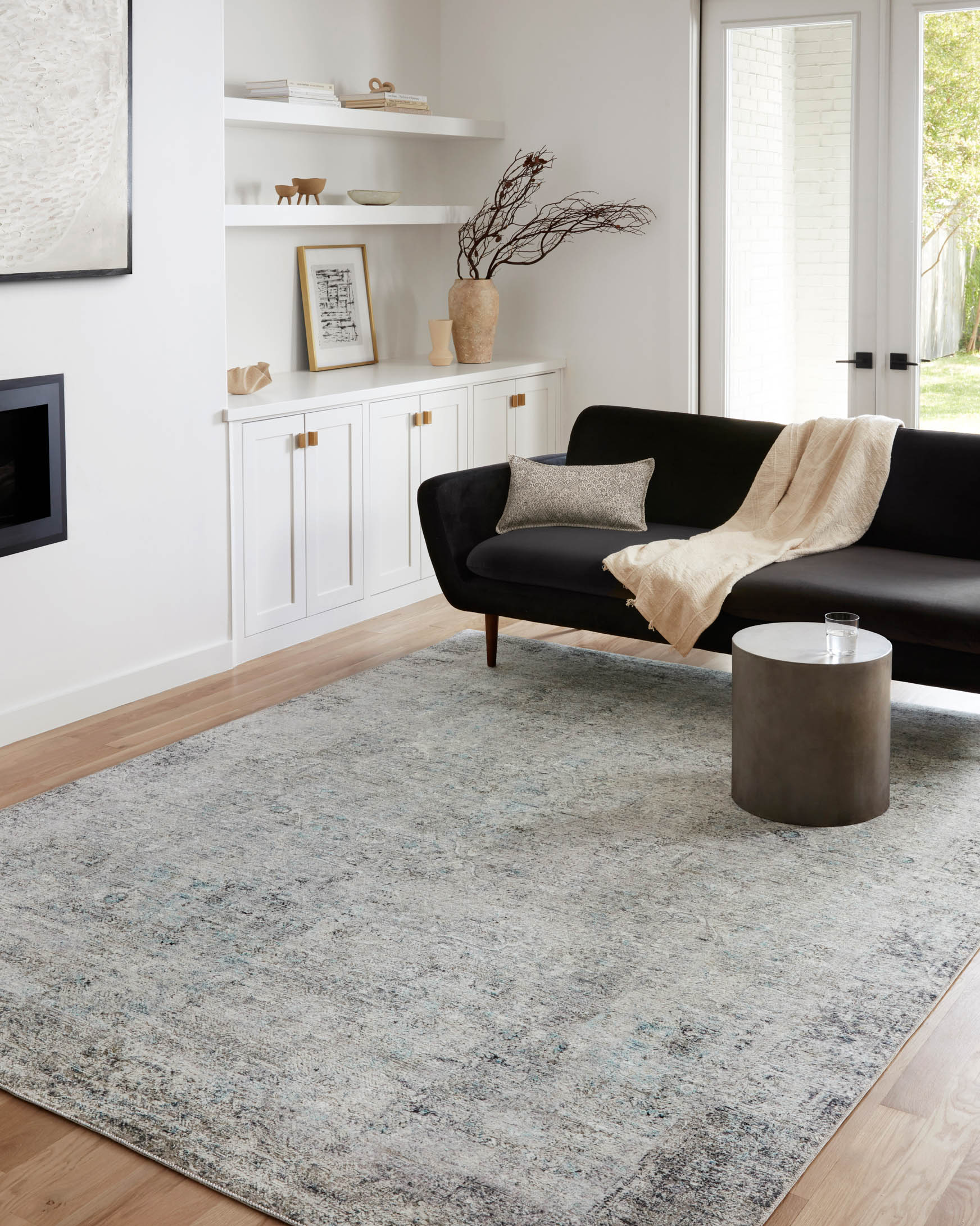 Contemporary ivory and silver area rug with distressed texture and abstract pattern.
